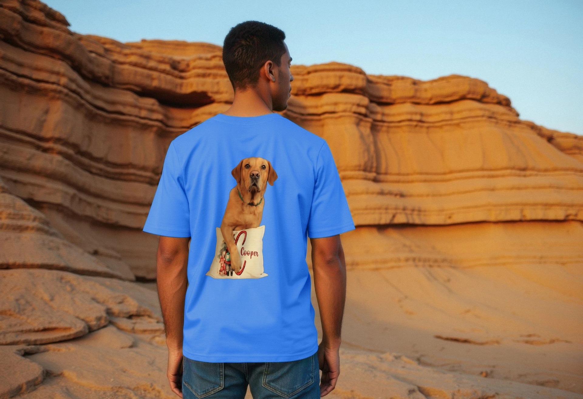 The picture contains an image of a person wearing a blue t-shirt with a brilliant pet dog called Cooper displayed on it